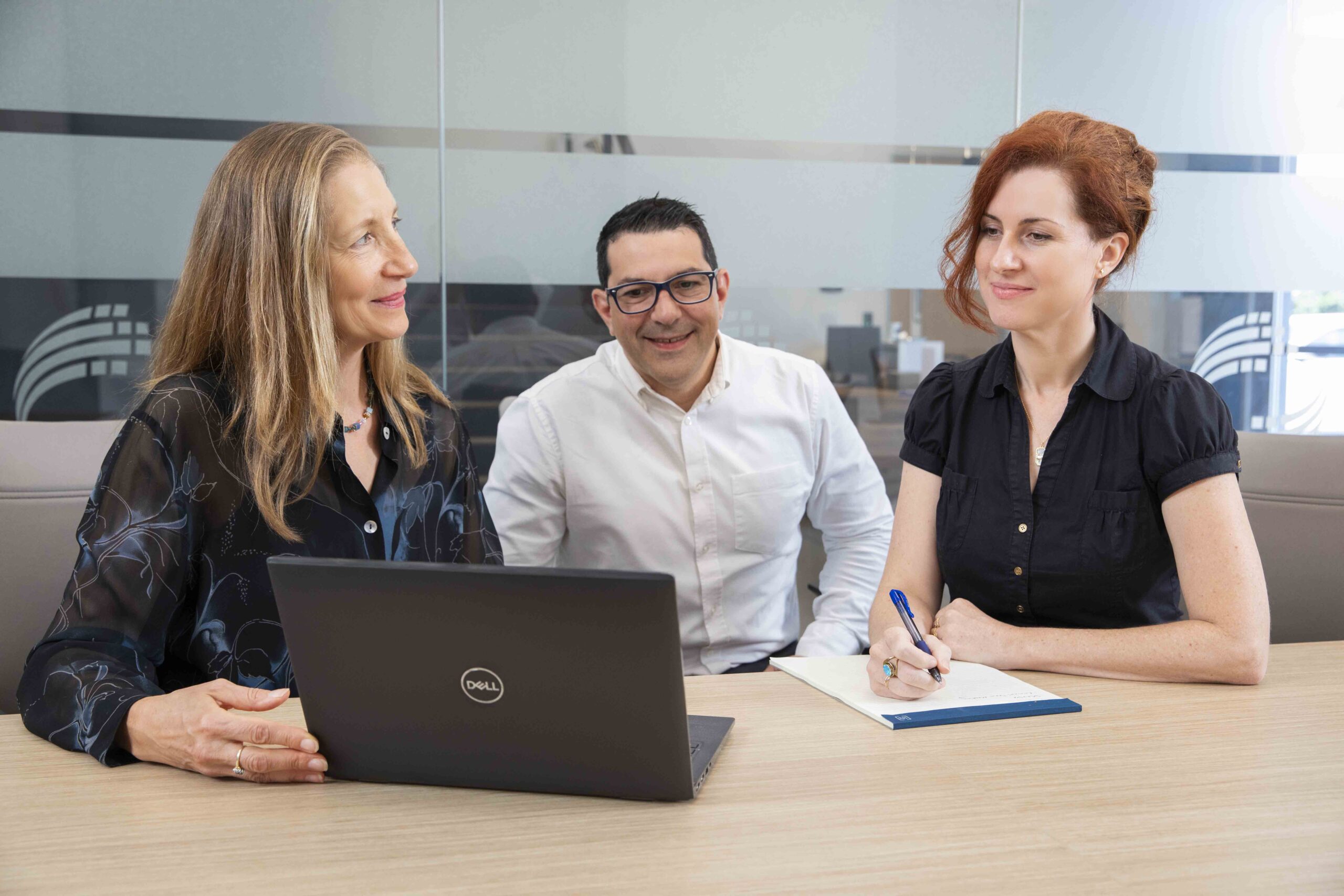 DCN Dx regulatory affairs and clinical research team members discussing CLIA waiver study design in DCN Dx's Carlsbad, California offices.